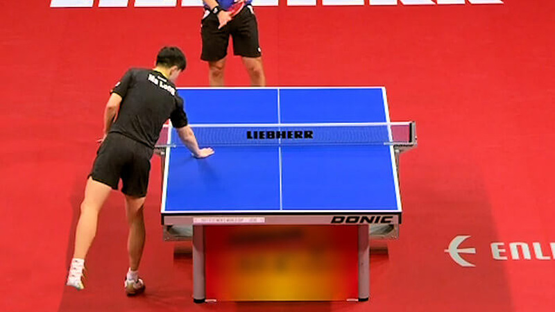 Table Tennis Players Touch The Table