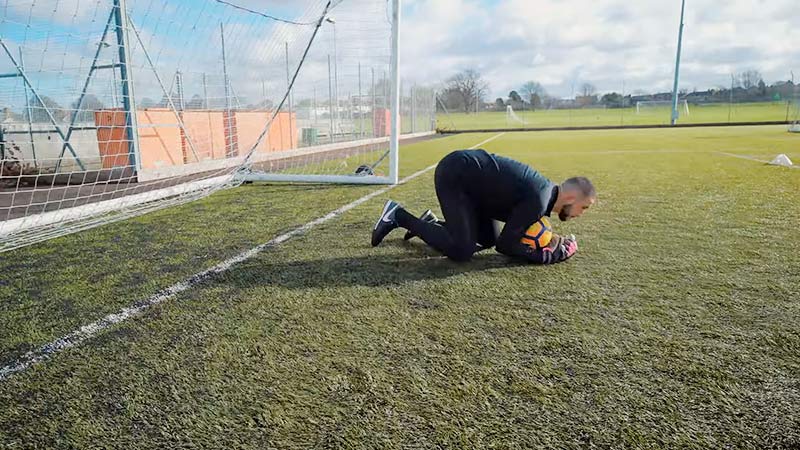 What happens if the goalie holds the ball too long?