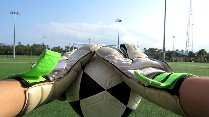 How far can a soccer goalie carry the ball?