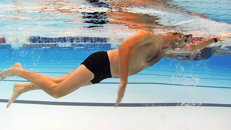 What does it mean to kick from the hips in swimming?