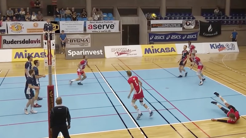 Is hitting the line in volleyball out?