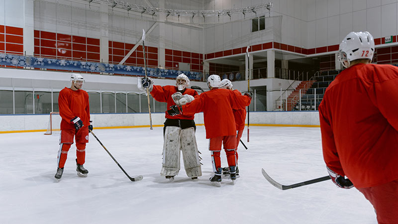 How does an assist work in hockey?