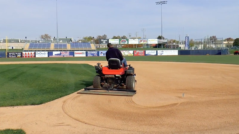 What is the proper way to drag a baseball field