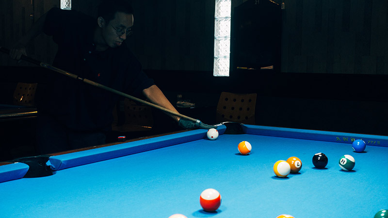 According to Harold Hadley, who explains this term in his short story “Behind the Eight ball,” this situation occurs when there are too many balls for one player and not enough for all players.