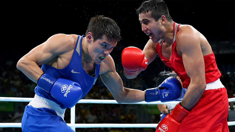 Why are pro boxers not allowed in the Olympics