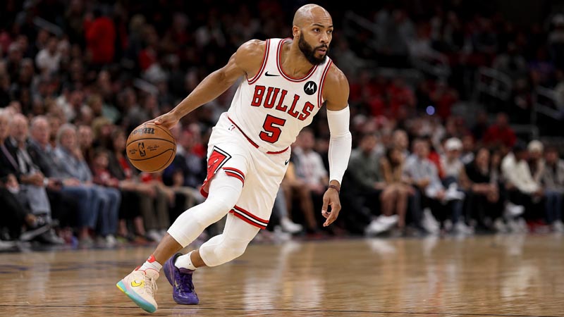 why does jevon carter wear two different shoes