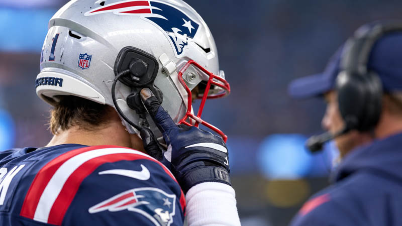 why do nfl players use helmet radios